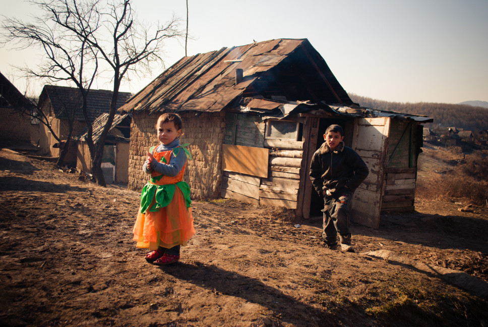 serednie-ukraine-march-09-2011-romani-boy-and-little-girl-in-orange-pumpkin-style-dress-over-clothes_t20_dzoxaJ.jpg